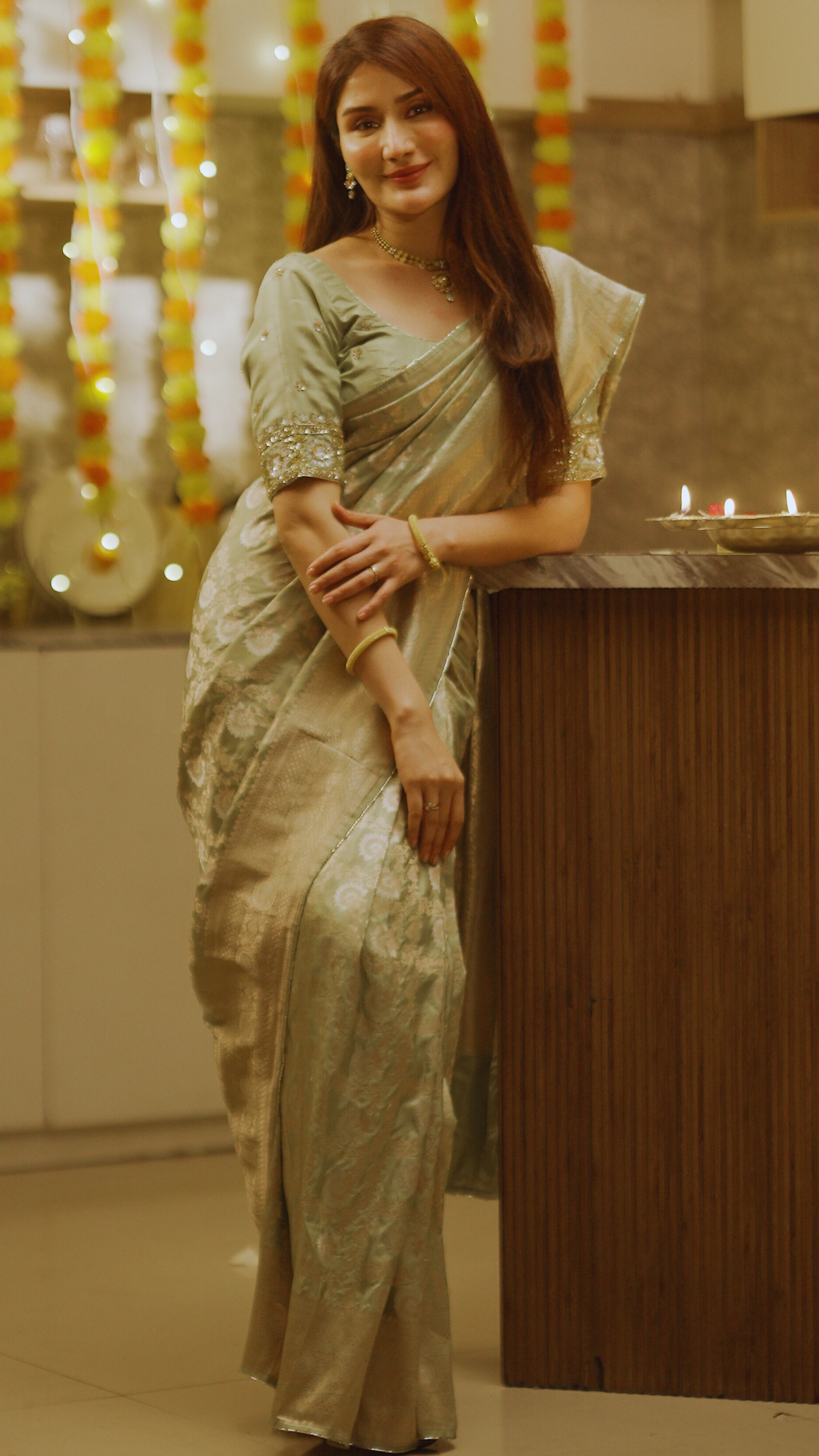 Light Green Pure Banarasi Silk Saree with Gold Floral Design and Matching Blouse.