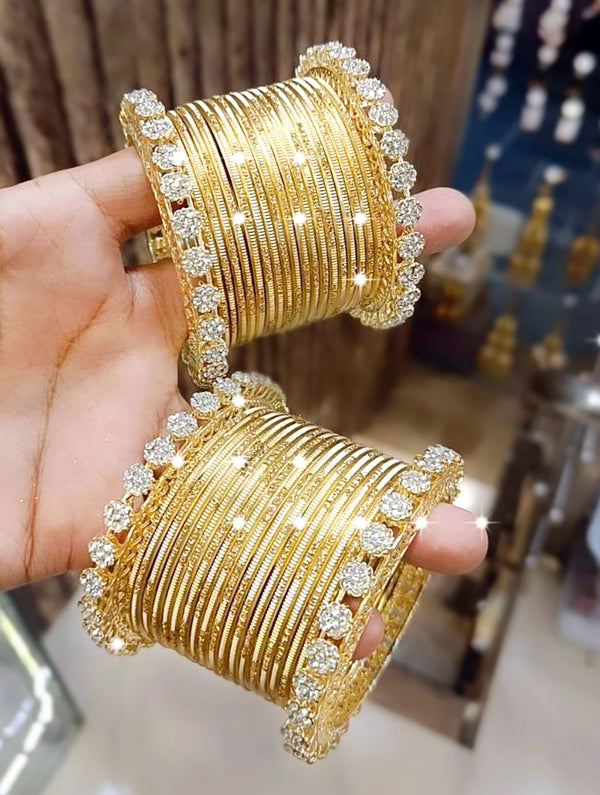 Elegant Golden Bangles with Intricate Stone Work - Nonita Fashion