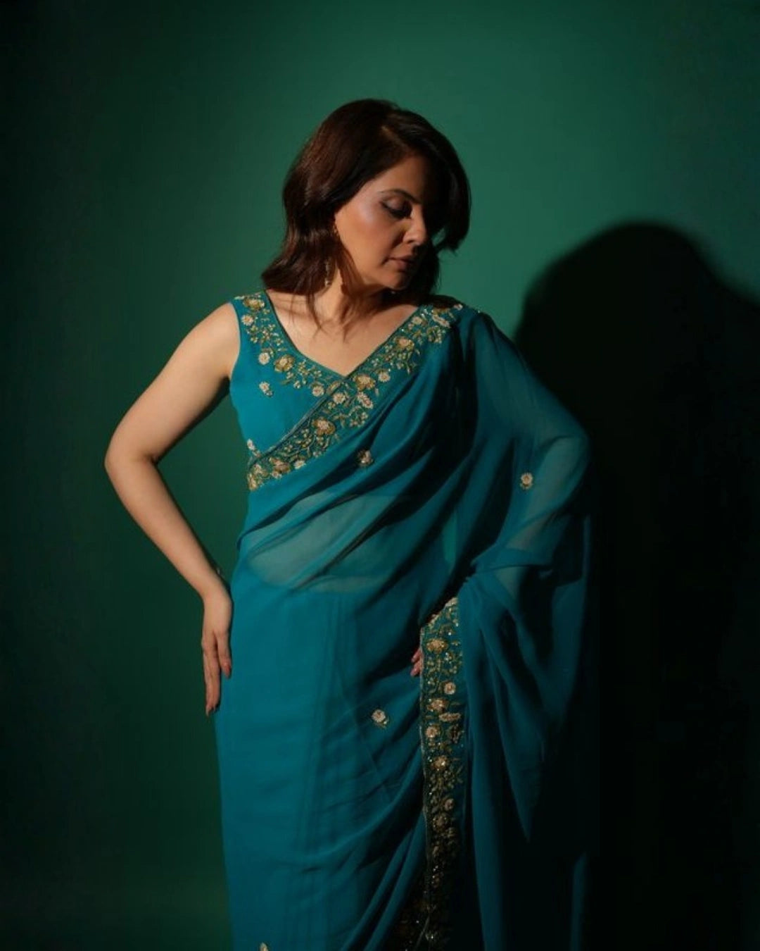 Peacock Blue Hand Embroidered Georgette Saree and Matching Floral Embroidered Blouse