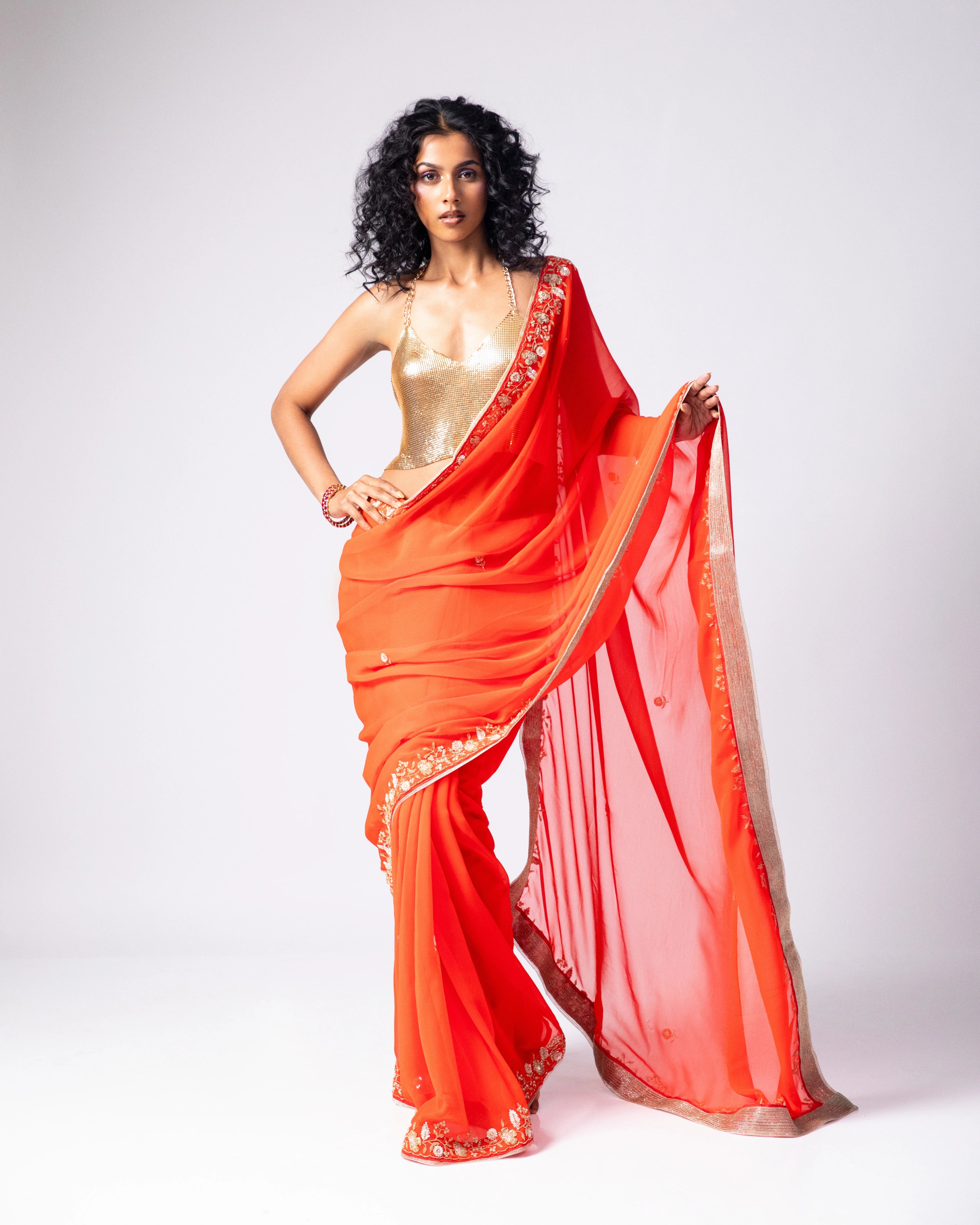 Orange Hand Embroidered Georgette Saree and Gold Metallic Blouse