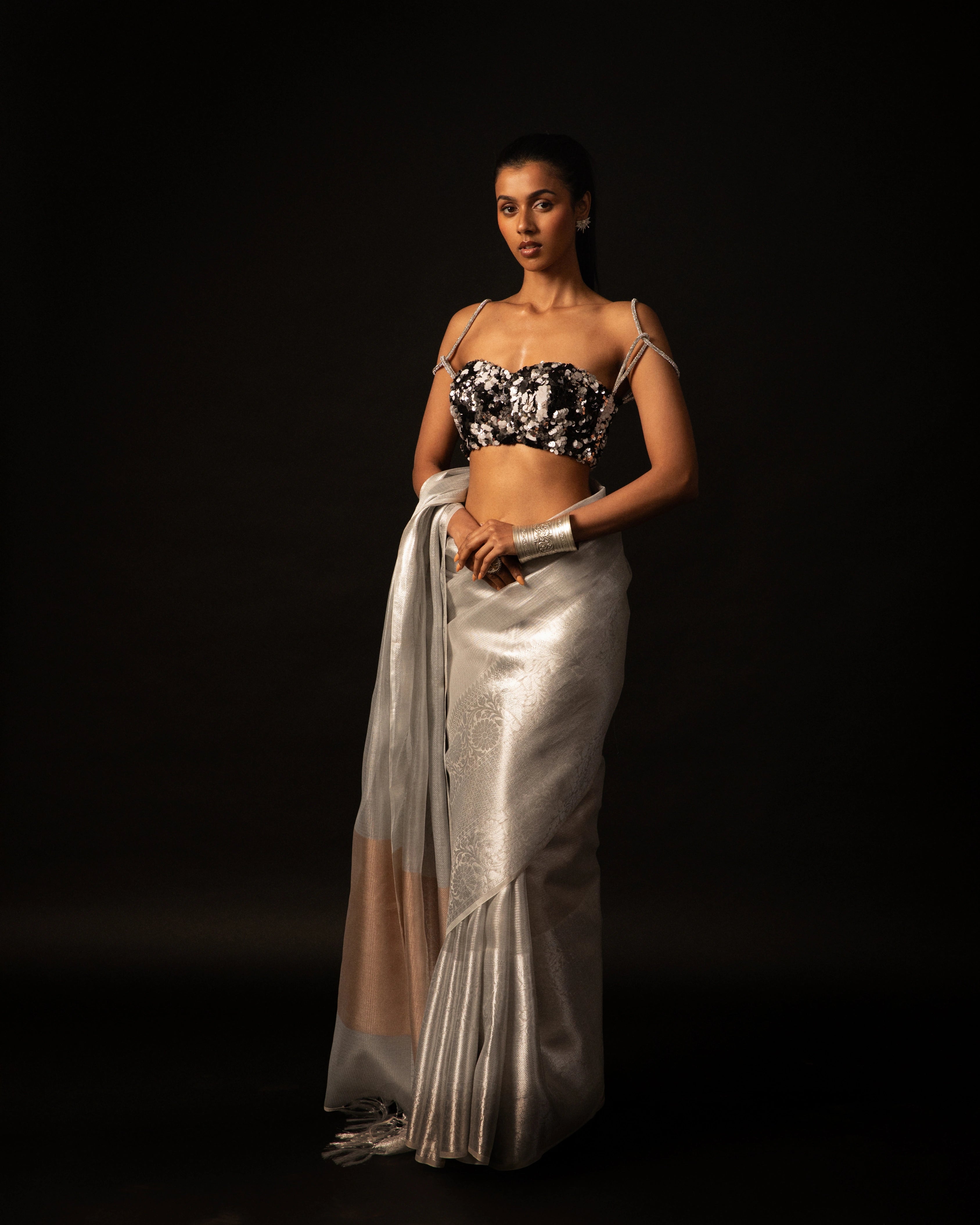 White Banarsi Silk Blend Metallic Tone Saree with Handwoven Border and Black Floral Sequin Blouse