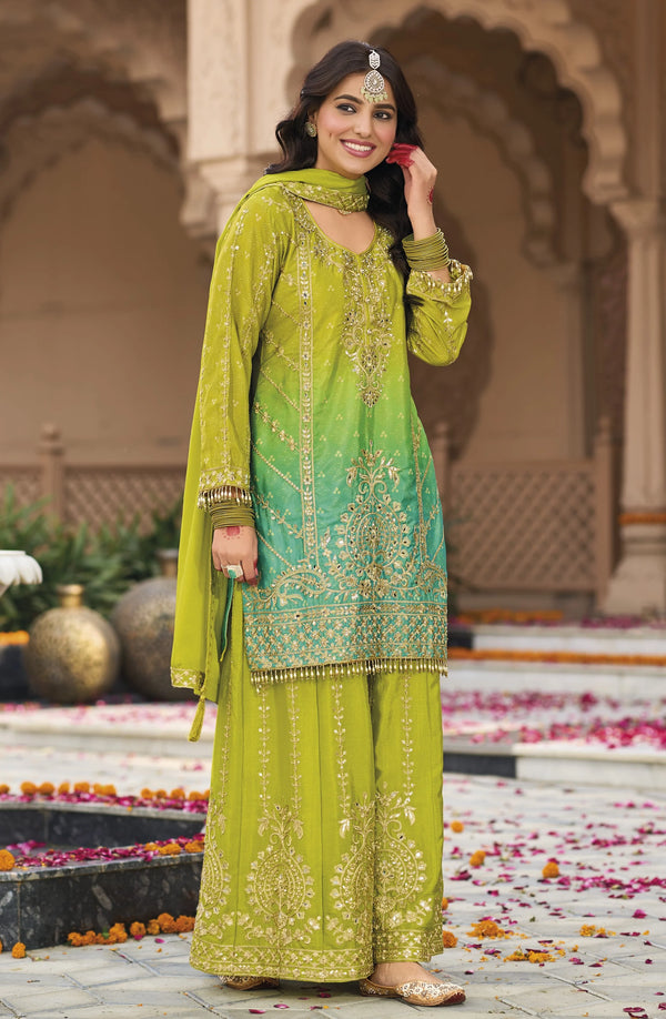 Green Silk Salwar Kameez with Heavy Embroidery Mirror Work
