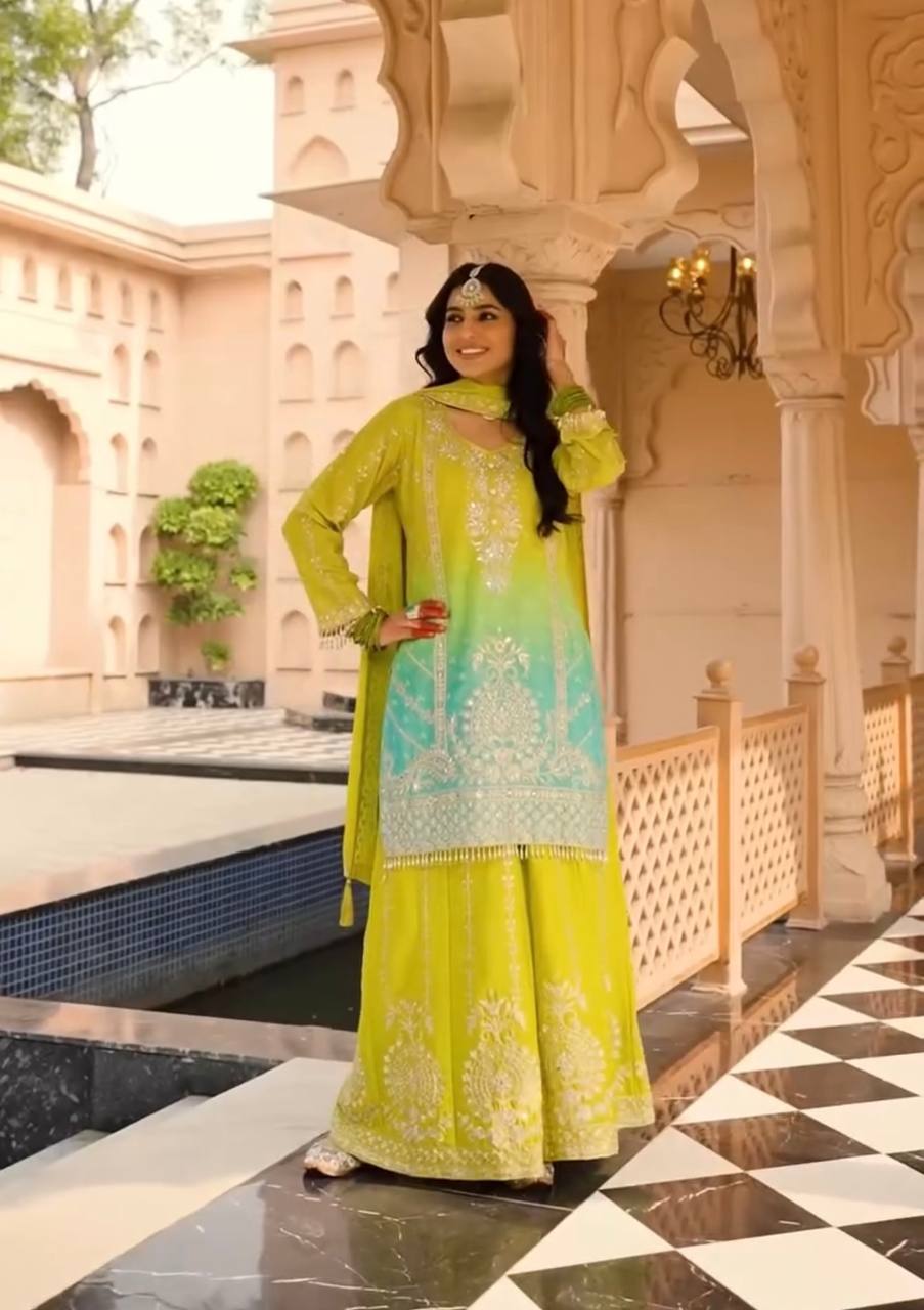 Green Silk Salwar Kameez with Heavy Embroidery Mirror Work
