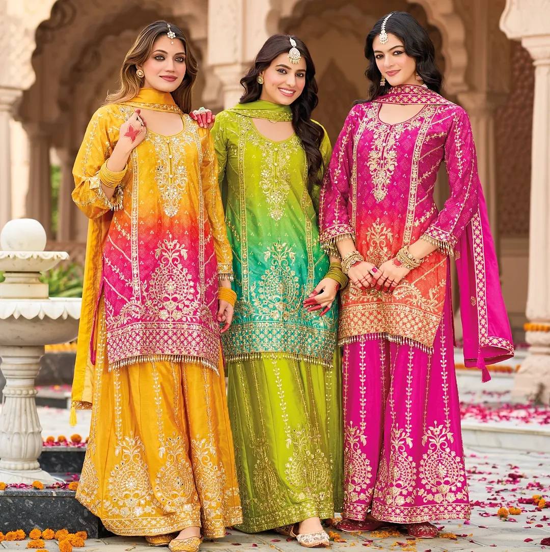 Green Silk Salwar Kameez with Heavy Embroidery Mirror Work