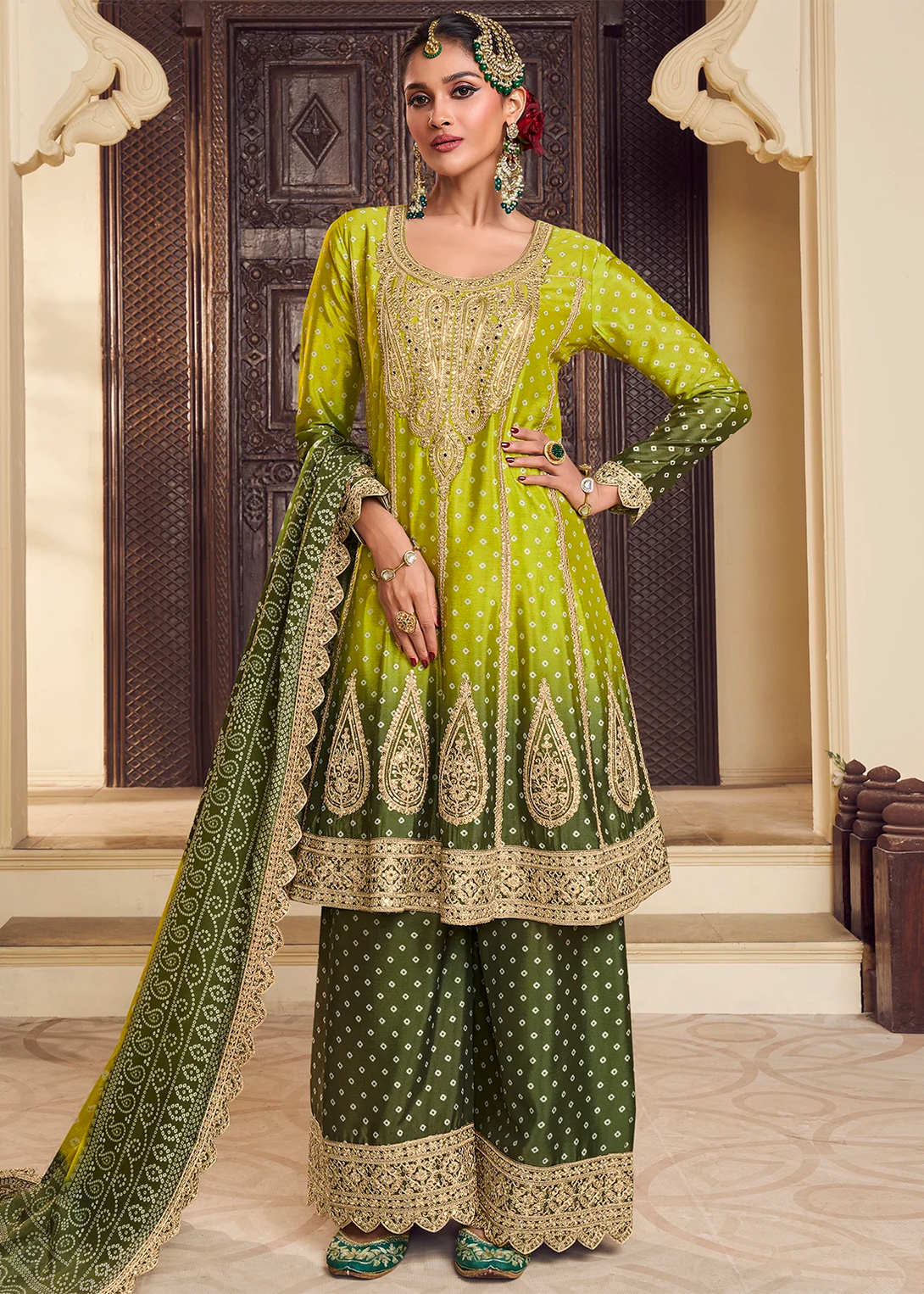 Green Silk Salwar Kameez with Intricate Motifs Design and Heavy golden thread embroidery Work
