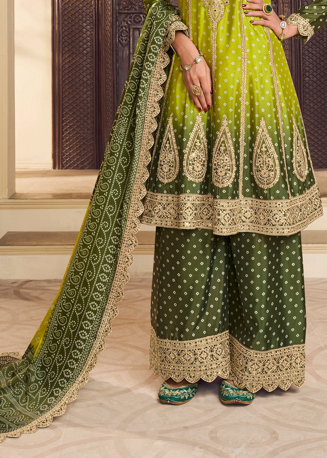 Green Silk Salwar Kameez with Intricate Motifs Design and Heavy golden thread embroidery Work

