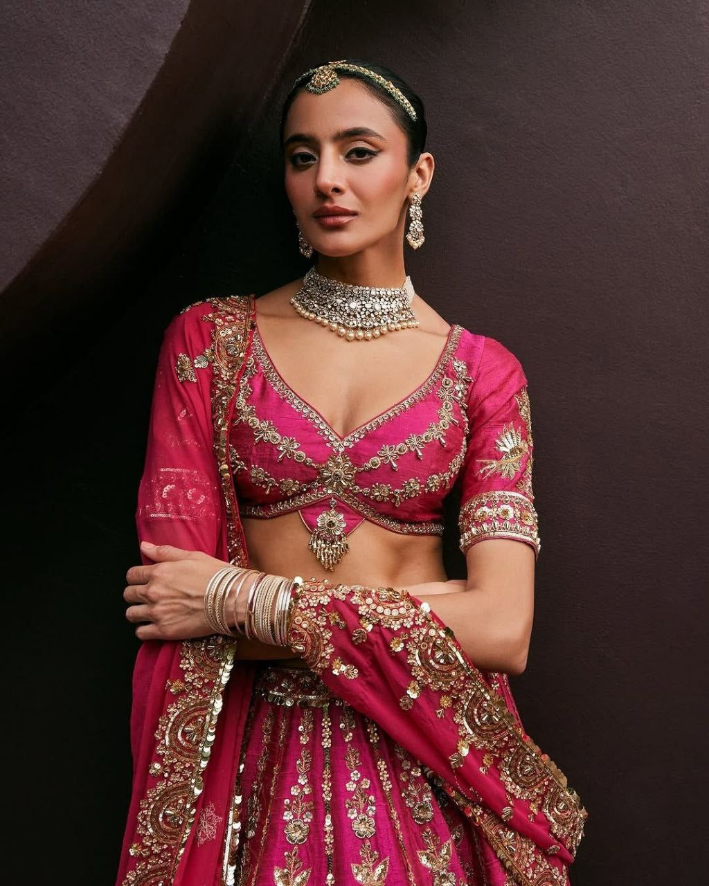 Magenta Pink Bridal Silk Lehenga with Heavy Zari Embroidery, Stone Work, and Royal Motif Design
