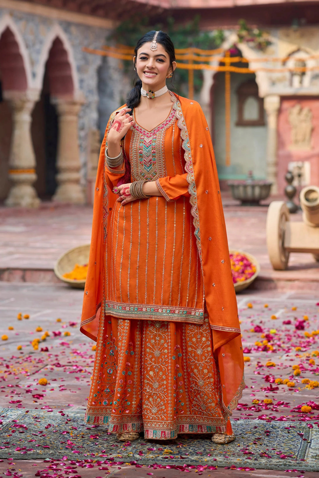 Orange Silk Salwar Kameez with Zardozi Embroidery and Mirror Work
