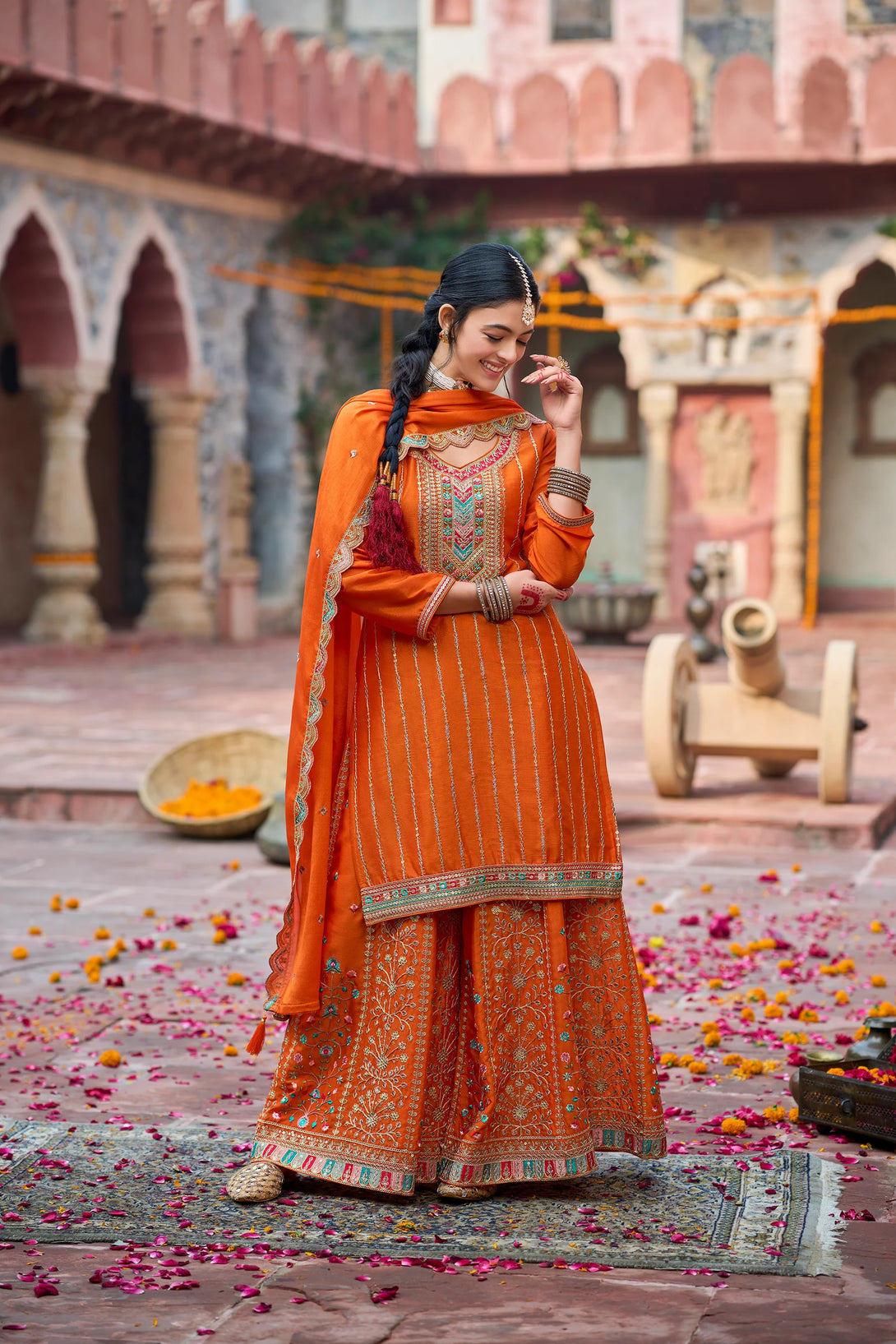 Orange Silk Salwar Kameez with Zardozi Embroidery and Mirror Work
