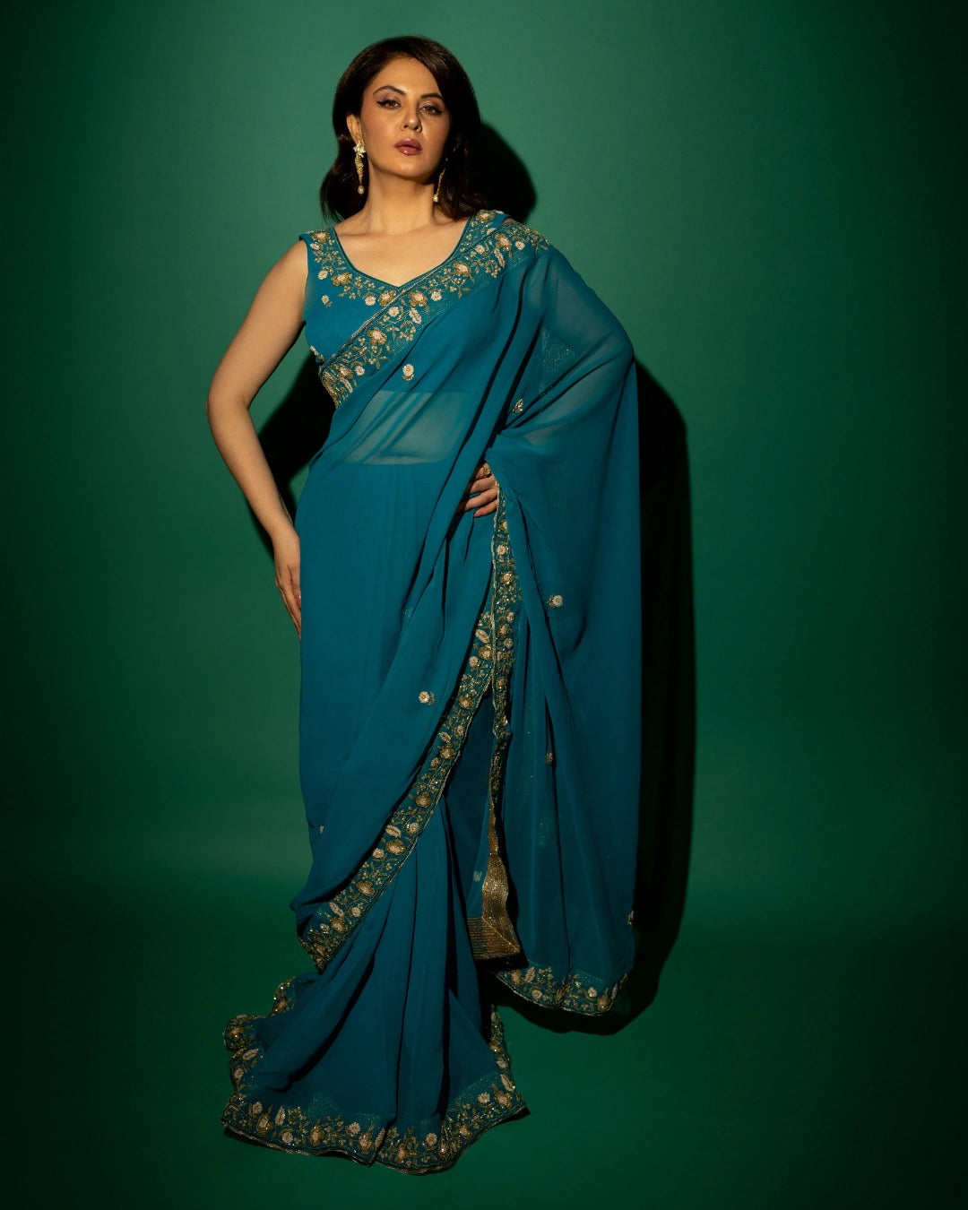 Peacock Blue Hand Embroidered Georgette Saree and Matching Floral Embroidered Blouse