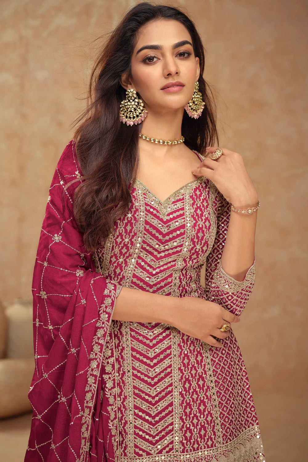 Pink Georgette Salwar Kameez featuring Chevron Pattern with Sequin and Motif Design
