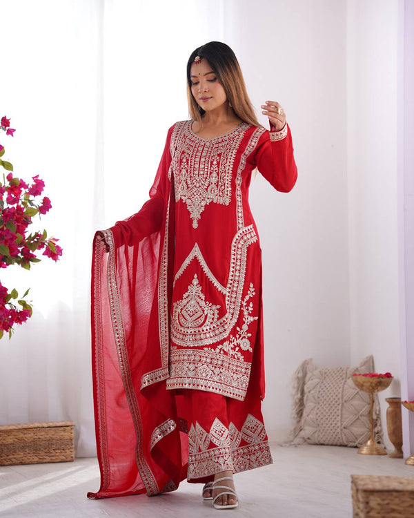 Red Silk Salwar Kameez with Intricate Embroidery and Thread Work
