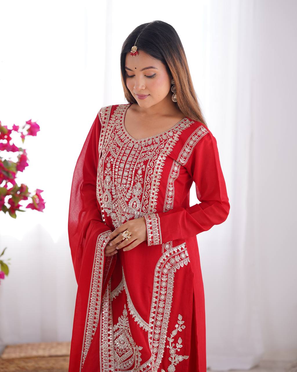 Red Silk Salwar Kameez with Intricate Embroidery and Thread Work
