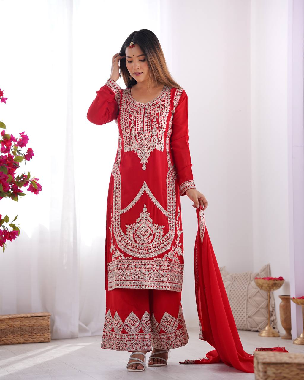 Red Silk Salwar Kameez with Intricate Embroidery and Thread Work
