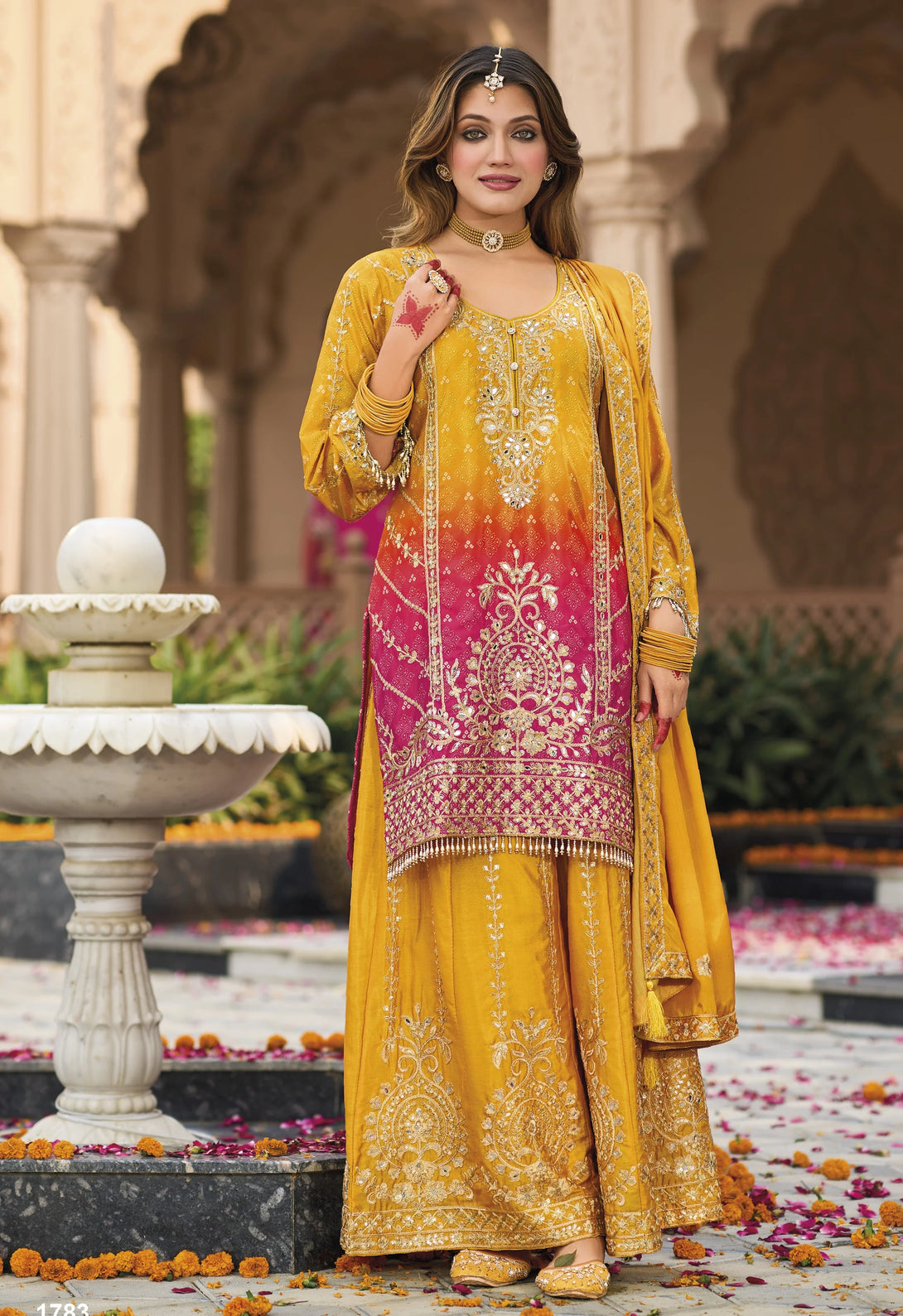 Yellow Silk Salwar Kameez with Heavy Embroidery Mirror Work
