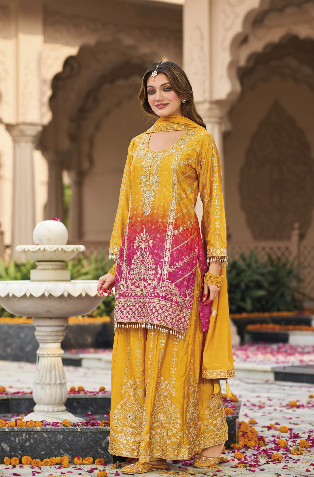 Yellow Silk Salwar Kameez with Heavy Embroidery Mirror Work